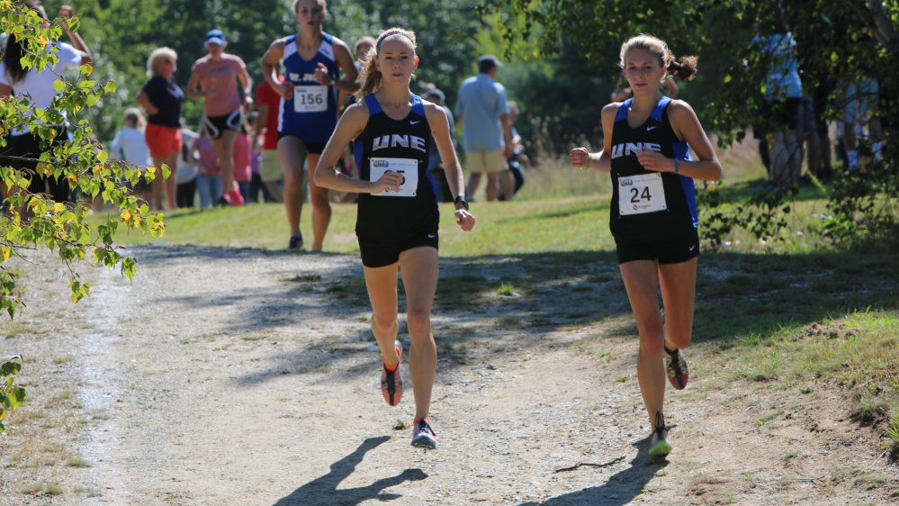 Contributed photo/UNE athletics 
 Tiana Thomas, left, a 2013 Waterville Senior High School graduate, competes on the University of New England cross country team. She hopes to qualify for the NCAA championship meet.