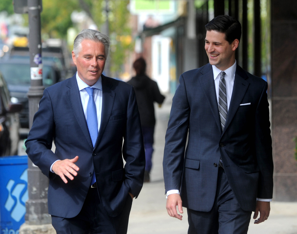 Colby College President David Greene and Waterville Mayor Nick Isgro walk down Main Street in downtown Waterville in October 2015. 