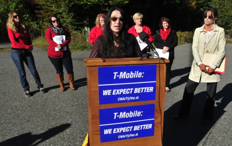 OAKLAND,ME.-October 6: Former T-Mobile employee Angela Agganis addresses the media outside the Oakland company about taking the call center to court after her treatment following her complaint of sexual harassment  made by her against another employee. She is surrounded by Communications Workers of America and her attorney Allison Gray at right. (Photo by David Leaming/Staff Photographer)