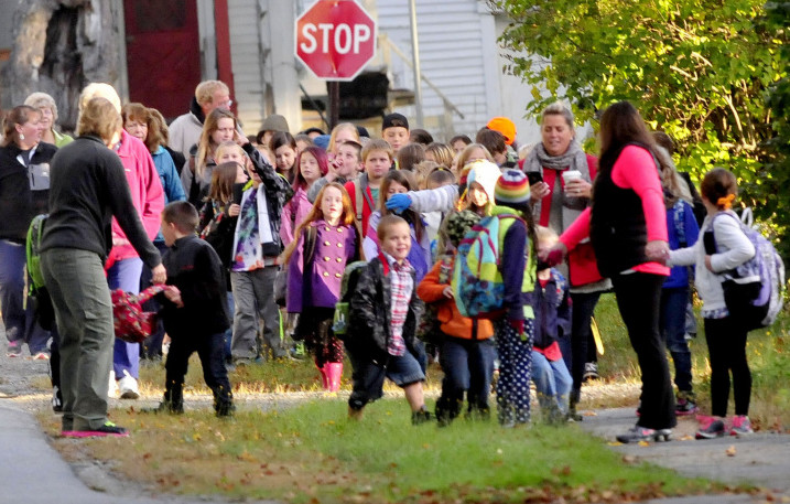 Solon Elementary School students, teachers and parents took part in a Walking School Bus Tuesday, in which they gathered in town and walked down to school.