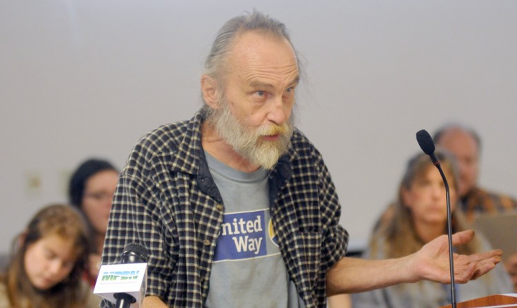 Homeless advocate Jim Devine, of Portland, speaks against a state proposal to conduct asset tests on people receiving state-administered aid during a hearing Tuesday in Augusta.