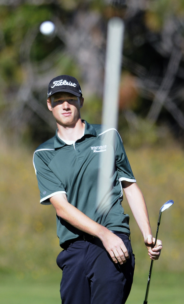 Staff photo by Andy Molloy
Winthrop High School’s Anthony Owens watches his shot on to a green during the Mountain Valley Conference state golf qualifier Wednesday at Natanis Golf Course. Owens shot an 83 to finish second overall.
