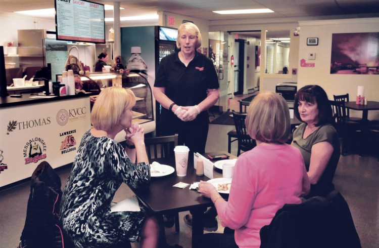 Toast XPress owner Cindy Scott speaks with customers from left, Roxanne Perrault, Terry Hiltz and Susan Tuthill at the diner early Thursday.