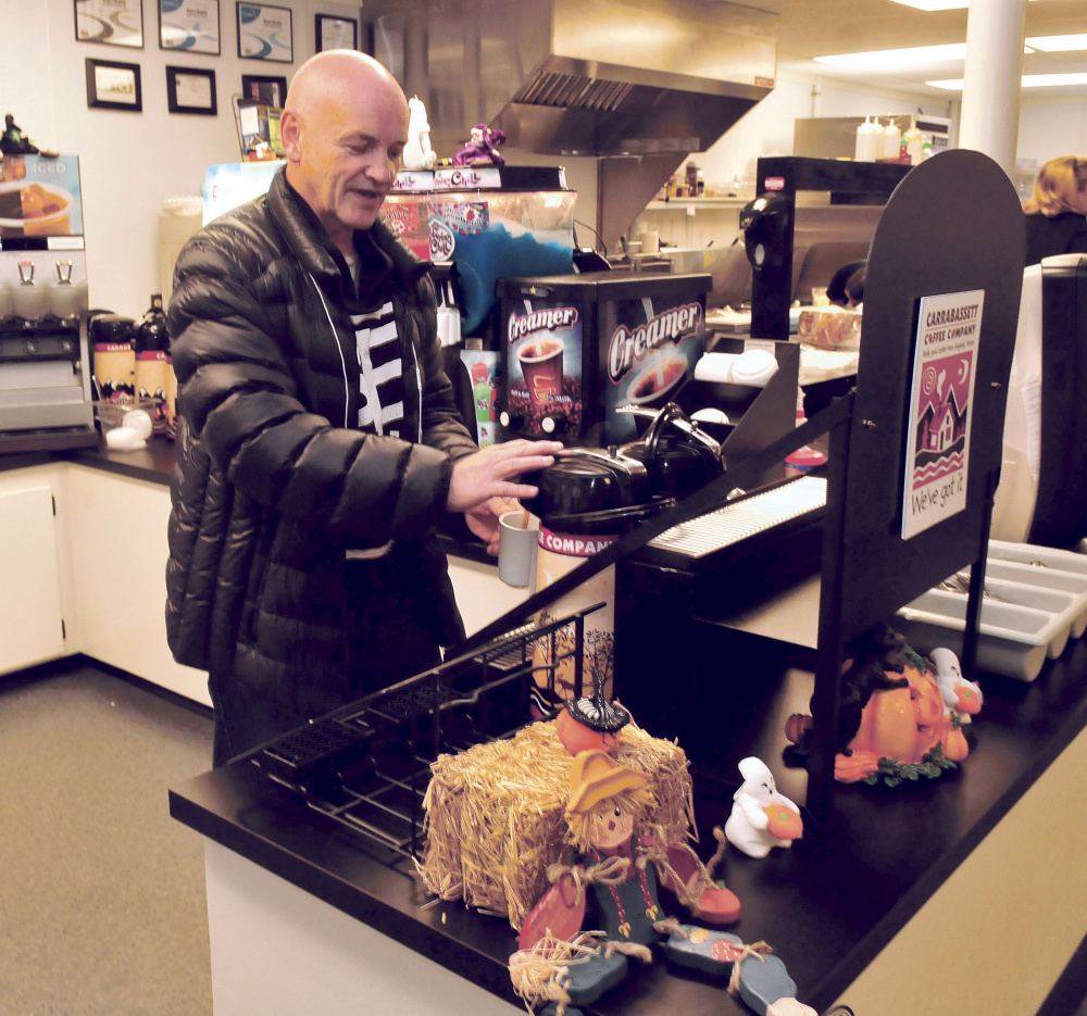 Customer James Pryor loads up on coffee before his breakfast at the Toast XPress diner in Waterville on Thursday.