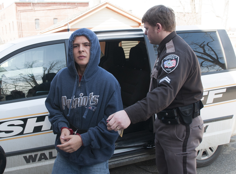 Colby Hodgdon, charged with stabbing his father, Steven Hodgdon, to death in Troy in March, is brought to Waldo County Superior Court in April following his arrest. Colby Hodgdon’s attorney says the state has moved that the 16-year-old be tried as an adult.