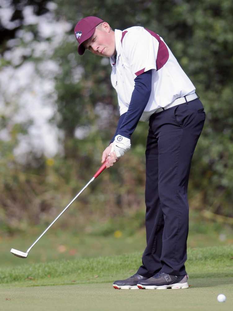 Staff photo by Andy Molloy 
 MCI's Eric Dugas putts during the Kennebec Valley Athletic Conference Shootout on Monday in Rockland. The Huskies should contend for the Class B state title Saturday at Natanis Golf Course.