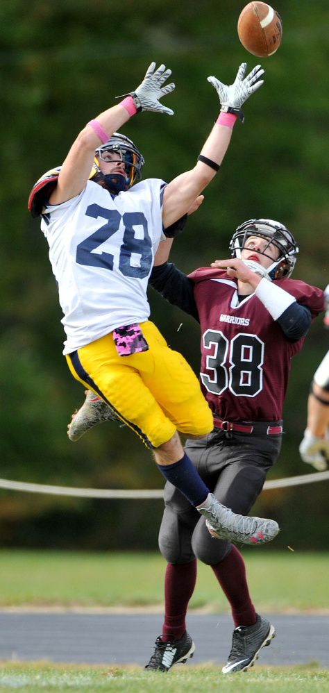 Mt. Blue High School’s Christian Whitney (28) nearly intercepts a pass intended for Nokomis High School’s Tyler Provencher (38) on Saturday in Newport.