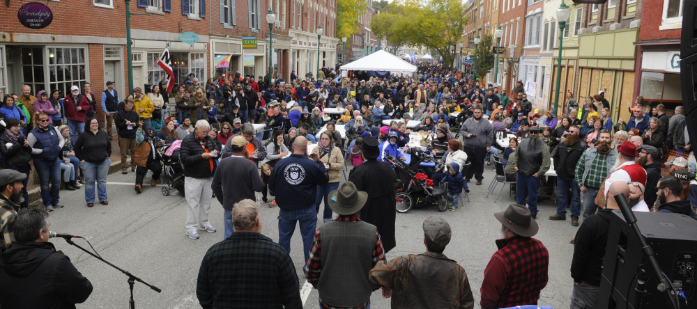 Competitors stand before judges during the Swine and Stein festivities on Saturday on Water Street in downtown Gardiner.