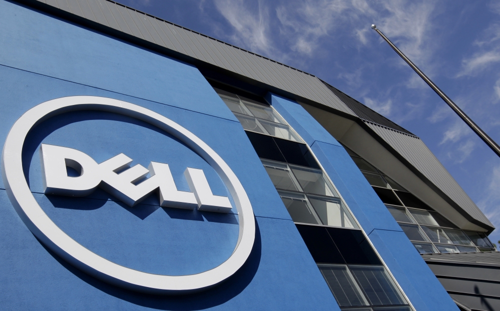 In this Tuesday, Aug. 21, 2012, file photo, the sun is reflected in the exterior of Dell Inc.’s offices in Santa Clara, Calif.