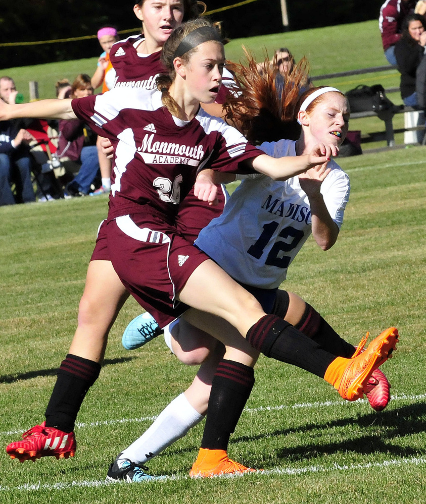 Monmouth’s Emily Grandahl. left, and Madison’s Ashley Emery clash during a game Monday in Madison.