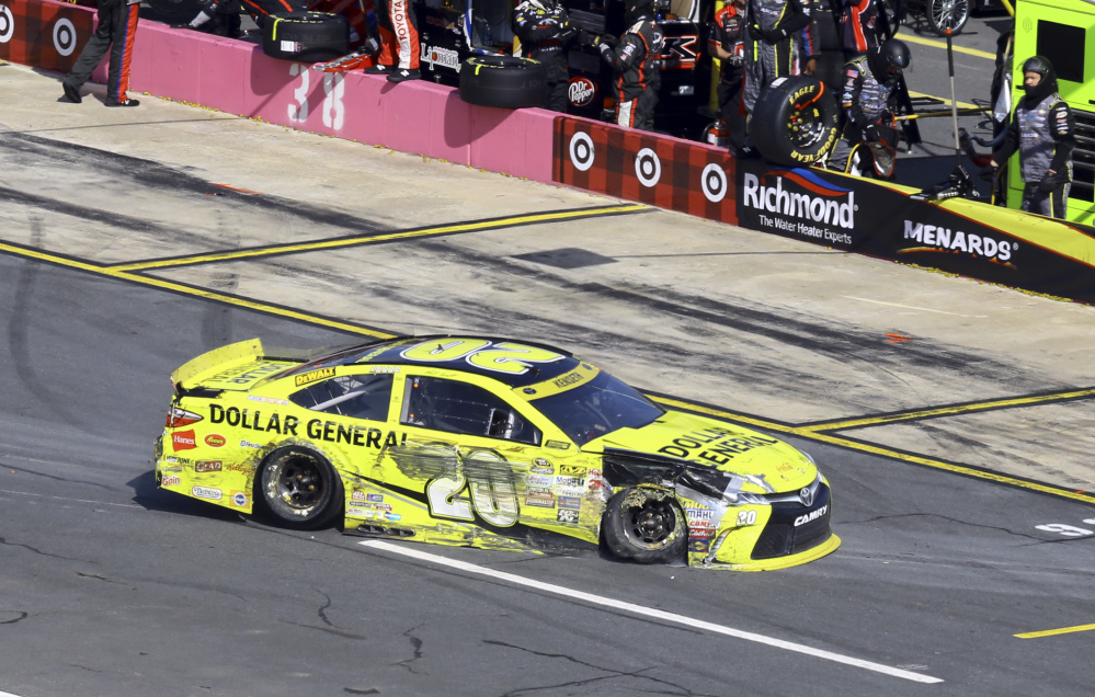 Matt Kenseth takes his damaged car to the garage area during the Bank of America 500 on Sunday at Charlotte Motor Speedway in Concord, N.C. After a 42nd-place finish, Kenseth finds himself 10th in the 12-driver Chase field.