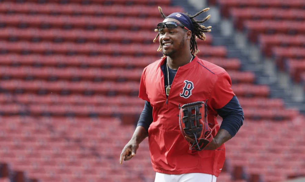 AP photo 
 In this July 7 file photo, Boston Red Sox outfielder Hanley Ramirez runs across the infield at Fenway Park in Boston.  New Boston Red Sox boss Dave Dombrowski says the team is committed to playing Hanley Ramirez at first base next season. Dombrowski says Ramirez and his representatives are also on board with the plan.