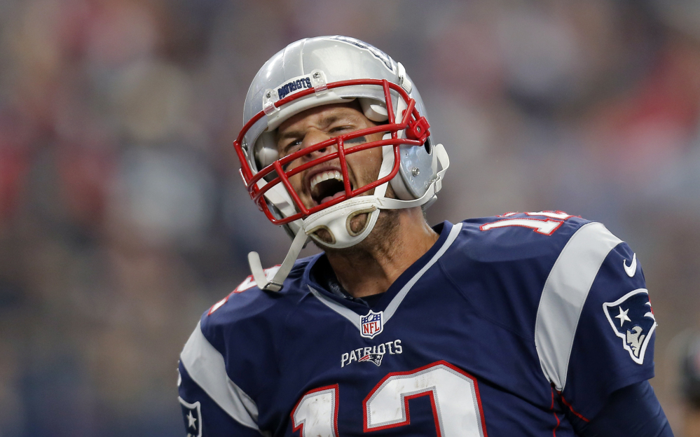 AP photo 
 New England Patriots quarterback Tom Brady celebrates after scoring on a 1-yard run against the Cowboys during the first half Sunday in Arlington, Texas. Next up for Brady and the undefeated Pats: A showdown at Indy against the Colts.