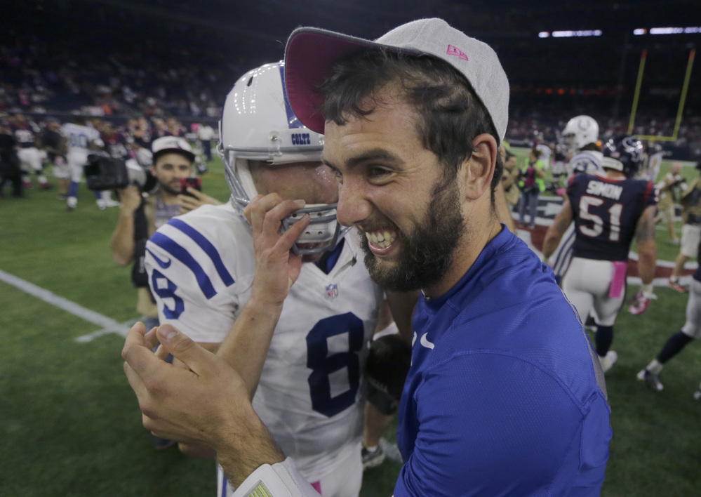 AP photo 
 Indianapolis injured quarterback Andrew Luck, right, celebrates with teammate Matt Hasselbeck (8) after they defeated the Texans last Thursday in Houston. Indianapolis won 27-20 and will next play rival New England.