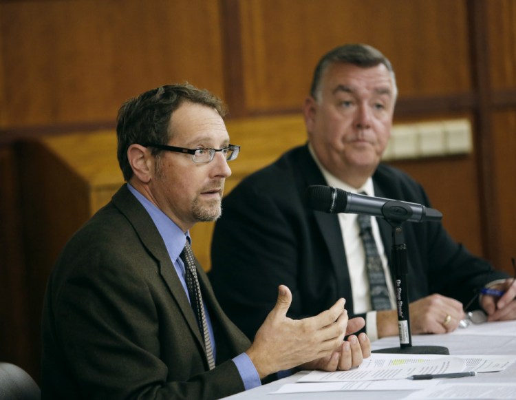 Dr. Chris Pezzullo, left, chief health officer, and Kenneth Albert, director and chief operating officer, of the Maine Center for Disease Control and Prevention , discuss the role that immunizations play in disease control and prevention, the public health immunization law and policy, and the tension between such law and personal autonomy.