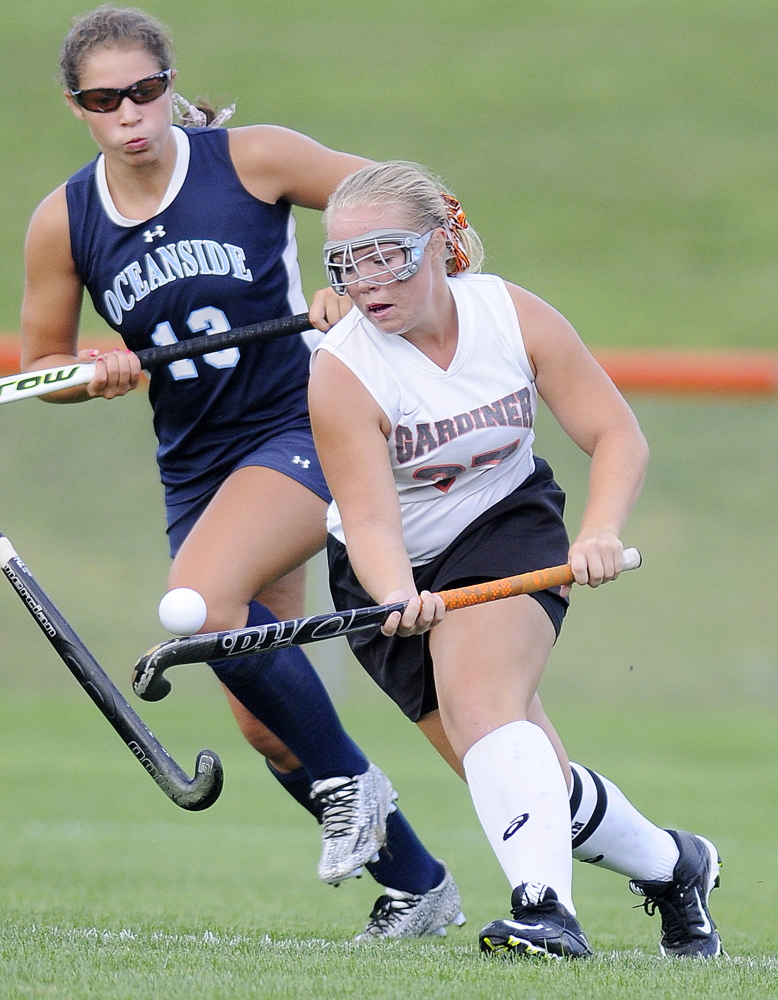 Staff file photo by Andy Molloy 
 Gardiner Area High School's Nickyia Lovely dribbles past Oceanside's Clara Feltus during a field hockey game Sept. 3 in Gardiner. The Tigers open the Class B North playoffs as the No. 1 seed.