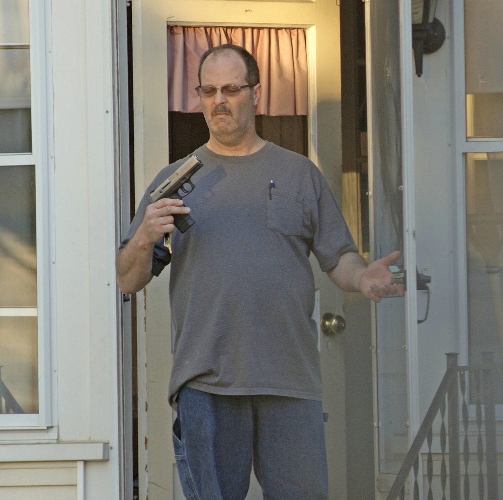 A picture taken by Barry Sturk, Susan Morissette’s boyfriend, shows her ex-husband, Wilfred Morissette, holding a handgun on First Street in Winslow during the May 2014 confrontation.
