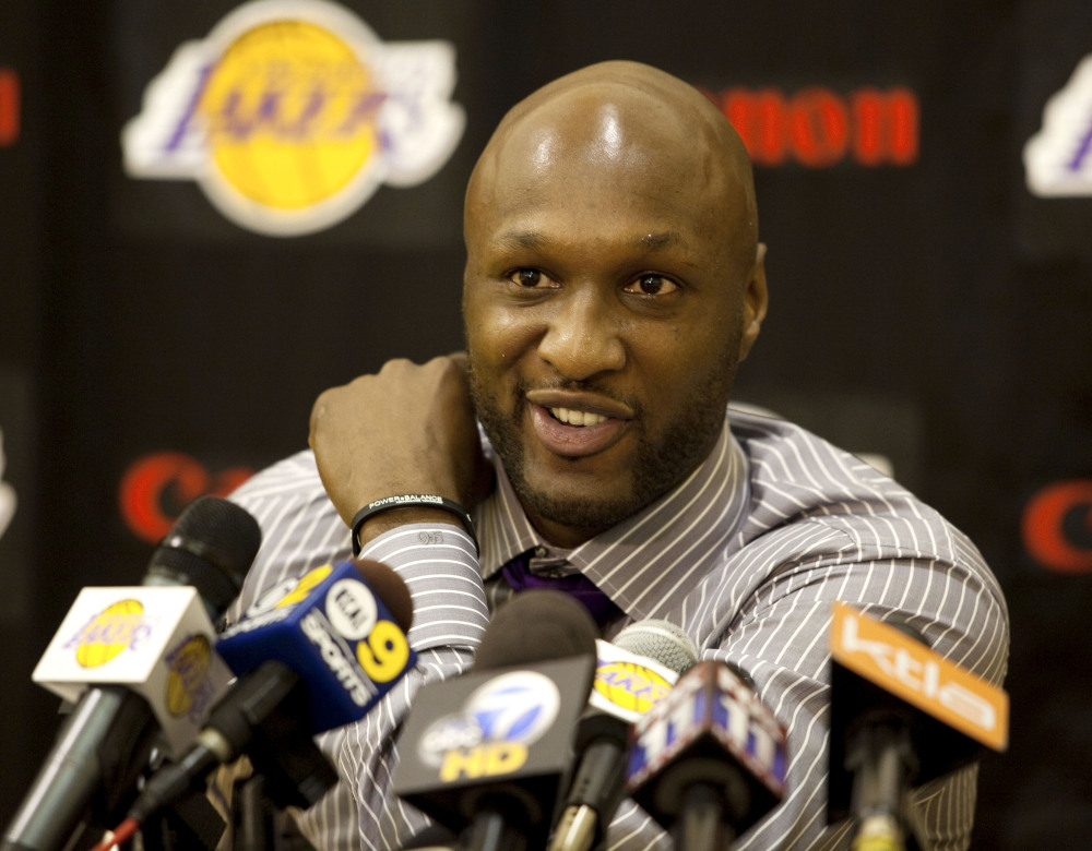 In this July 31, 2009, file photo, Los Angeles Lakers’ Lamar Odom speaks to the media during a news conference after the Lakers signed Odom to a multi-year NBA basketball contract, in El Segundo, Calif.