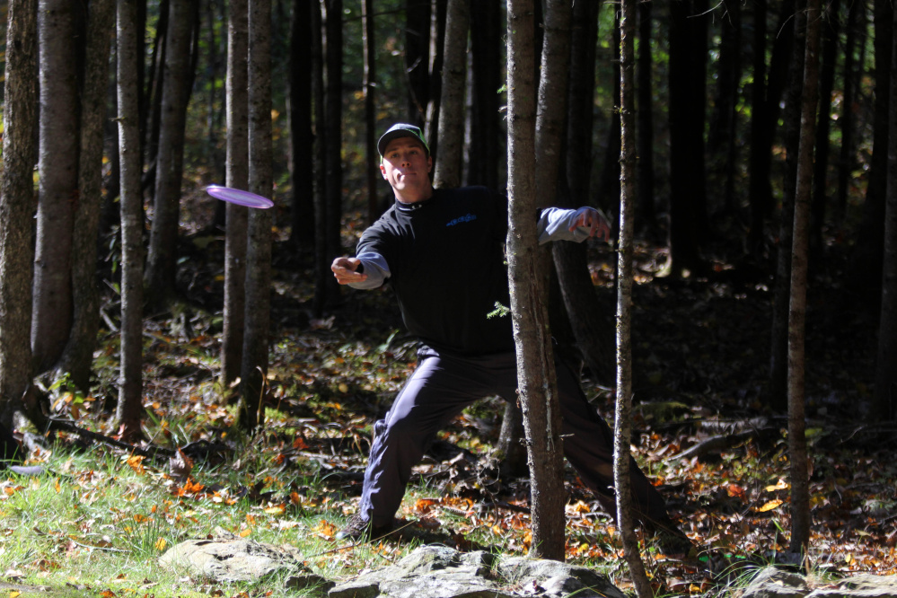 Matt Enman of Orrington makes his second throw on the par 3 No. 12 hole during the 2nd annual Porcupine Ridge PDGA Open at Porcupine Ridge on Sunday in Augusta.