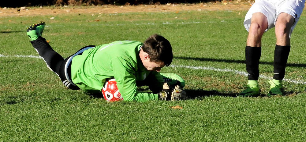 Carrabec keeper Trent Richardson comes up with a save during a Mountain Valley Conference game against Hall-Dale on Monday in North Anson.