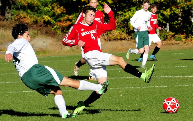 Carrabec’s Paul Kaplan, left, and Hall Dale’s Tyler Nadeau try to get a leg up during a Mountain Valley Conference game Monday afternoon in North Anson. Nadeau’s goal with 21 minutes left was the difference as Hall-Dale prevailed 1-0.