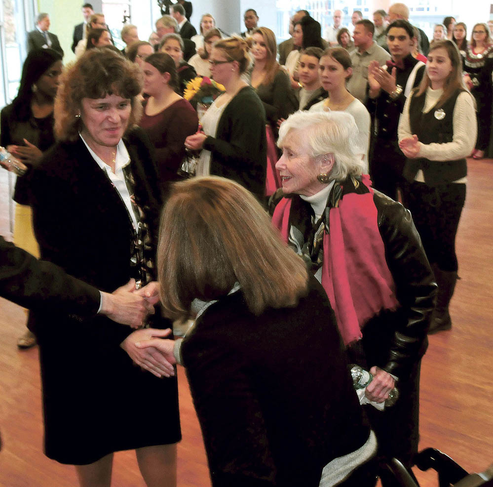 Thomas College President Laurie Lachance, left, Tuesday shakes hands with Margie Lunder Goldy, center, and Paula Lunder at Thomas College during a news conference announcing the Center for Innovation in Education. The Lunder Foundation contributed money toward the center.