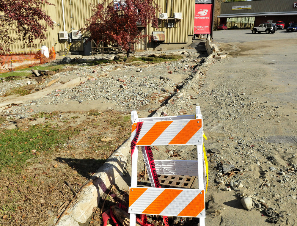 Rocks, gravel and pieces of pavement are washed up at Skowhegan Plaza Wednesday. A storm Sept. 20 caused the damage.
