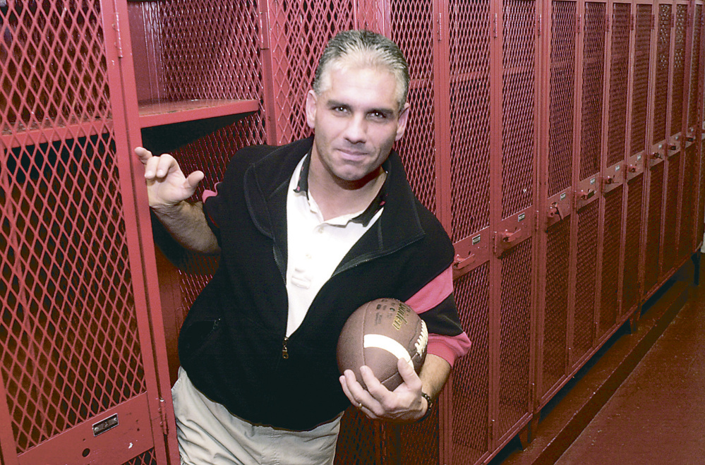 Staff file photo by Andy Molloy 
 This November 2000 file photo shows Tom Hinds, when he was named the Kennebec Journal Football Coach of the Year