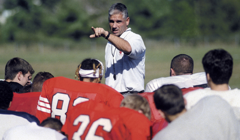 Staff file photo by Andy Molloy 
 Cony football coach Tom Hinds addresses the players during practice on Sept. 13, 2000.