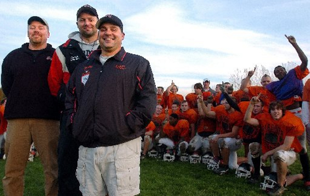 Staff file photo by Andy Molloy 
 Gardiner Area High School football coach Matt Brown, middle, poses with assistants Mike Gammon, left, and Jim Palmer during the 2005 season.