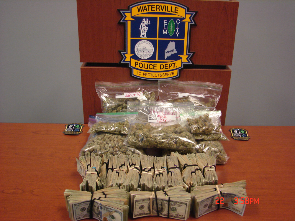 Waterville police seized 1.9 pounds of marijuana and $57,000 in cash from an Oak Street apartment in a search Thursday afternoon. Edward Dawe, 24, was arrested and charged with several trafficking counts.