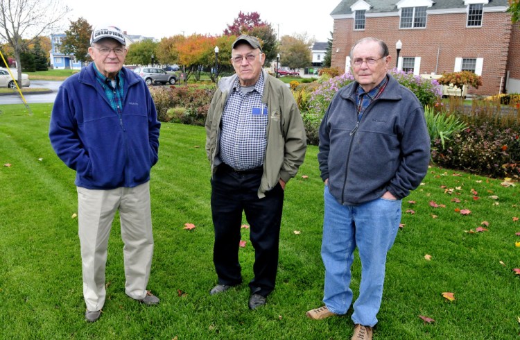 Local men who knew convicted killer and suspected serial killer Charles Terry when he resided in Waterville and neighboring towns as a young man are, from left, John McQuillan, his brother Robert and Lowell Hawes. The men are standing on the lawn of Kennebec Savings Bank, where the house at 95 Pleasant St. once stood. Terry lived there for the first 10 years of his life before moving to Winslow in 1941.