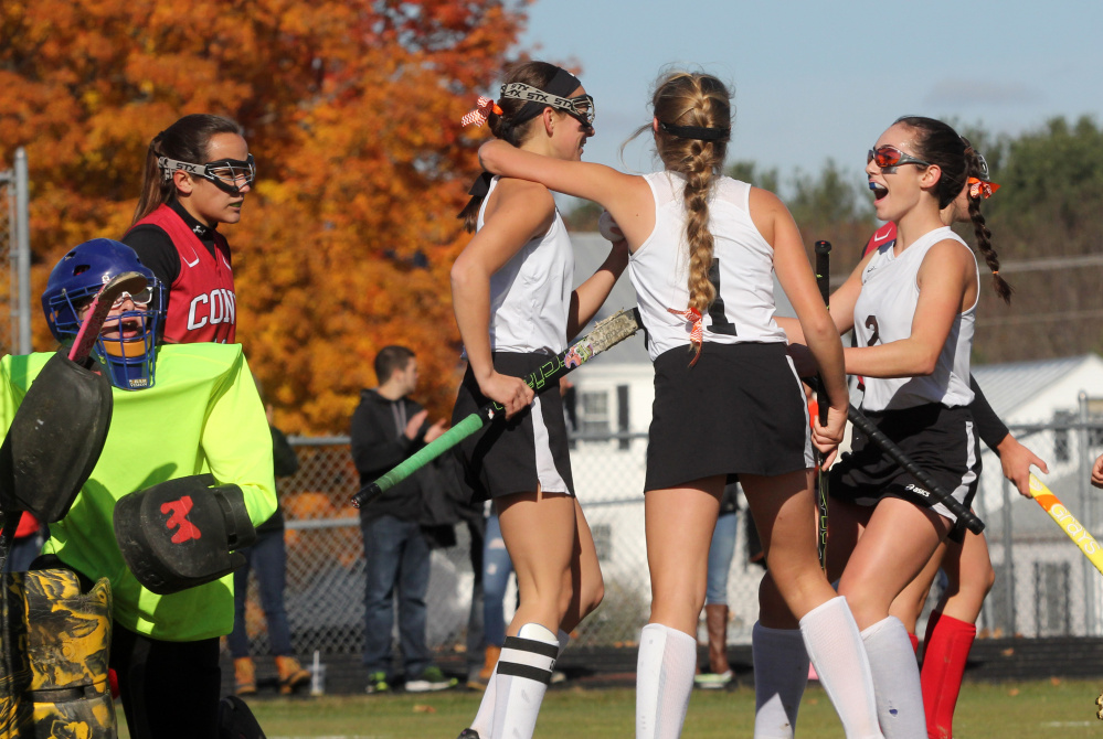 Photo by Jeff Pouland 
 Skowhegan Area High School's Brooke Michonski gets congratulated after scoring a first-half goal by teammates Julia Steeves (1) and Maliea Kelso (2) during a Class A North semifinal against Cony High School on Saturday in Skowhegan.