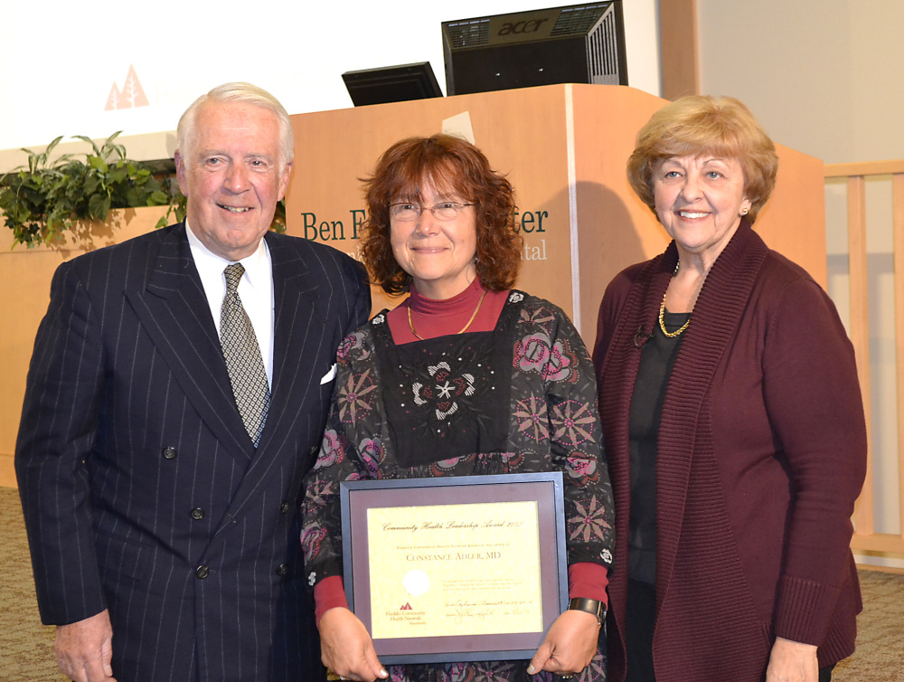 Dr. Connie Adler is presented with the Franklin Community Health Leadership Award. Pictured from left are Joseph Bujold, Adler and Rebecca Arsenault.