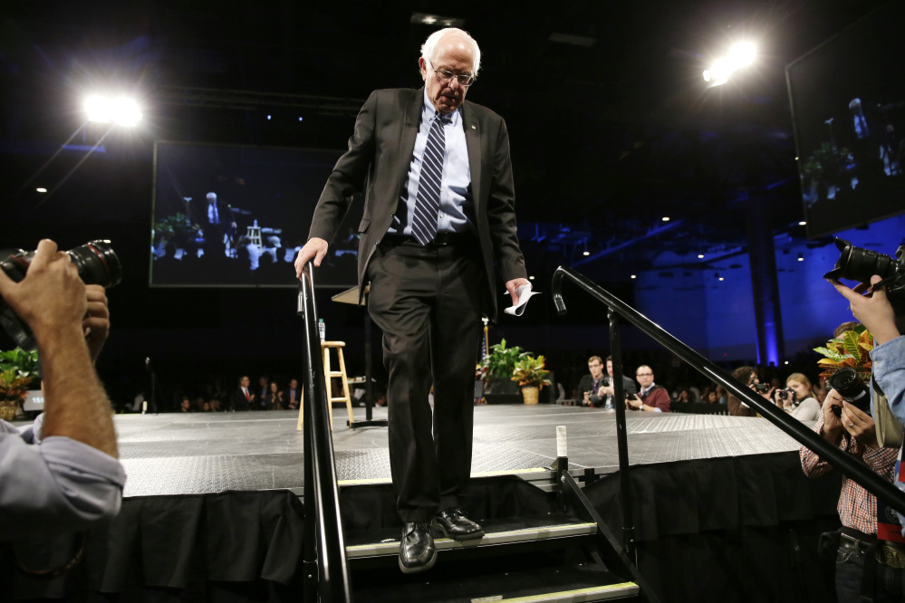 Democratic presidential candidate Sen. Bernie Sanders, I-Vt., walks off stage after speaking during the Iowa Democratic Party’s Jefferson-Jackson fundraising dinner, Saturday in Des Moines, Iowa.