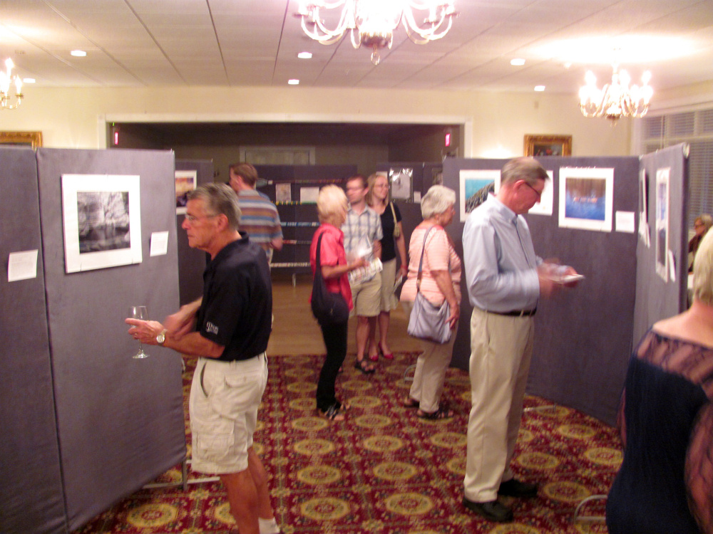 Photography enthusiasts viewed many works on display at the recent Western Mountain Photography Show, sponsored by the Rangeley Friends of the Arts at the historic Rangeley Inn and Tavern.