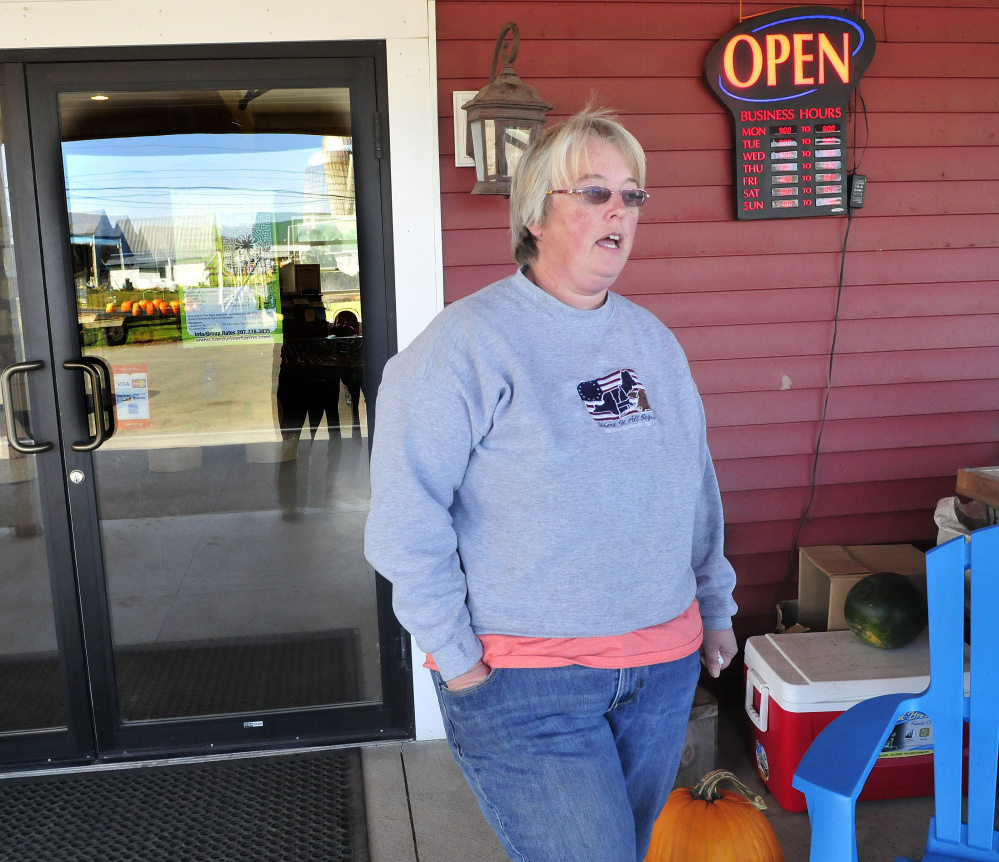Trudy Johnson, part owner of Sandy River Farm Market, on Tuesday discusses the recent burglary at the Farmington store.