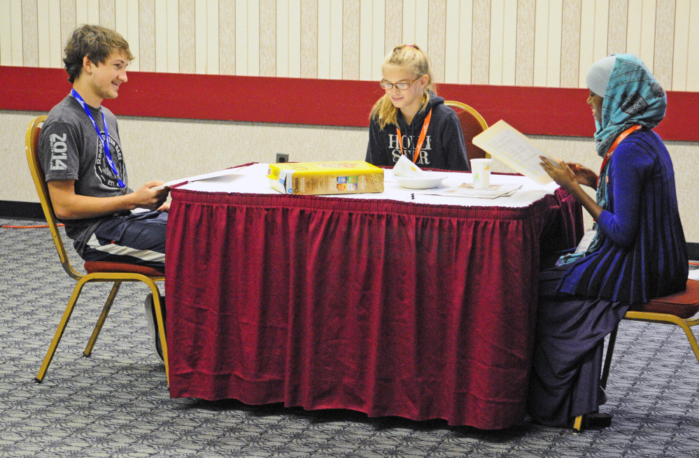 Zach Blackman, of Boothbay, Elaina Bradford, of Millinocket, and Amina Aden, of Lewiston, perform a skit as part session put on by the Out and Allied Youth Theater during the The Maine Youth Action Network event on Thursday in the Augusta Civic Center.