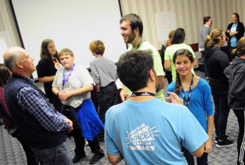People talk in pairs as part of a session during the The Maine Youth Action Network event on Thursday in the Augusta Civic Center.