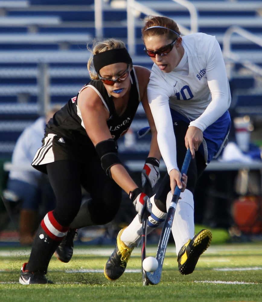 Kaitlyn Phillbrick, left, of Lisbon and Kylee Veilleux of Oak Hill battle for the ball during the second half of the Class C South championship game Tuesday at Fitzpatrick Stadium in Portland.