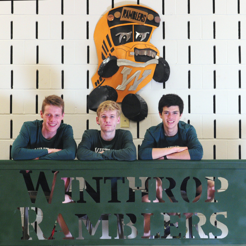 Winthrop’s Jacob Hickey, left, Jesse Stevens, center, and William Vance pose for a photo Thursday in Winthrop.