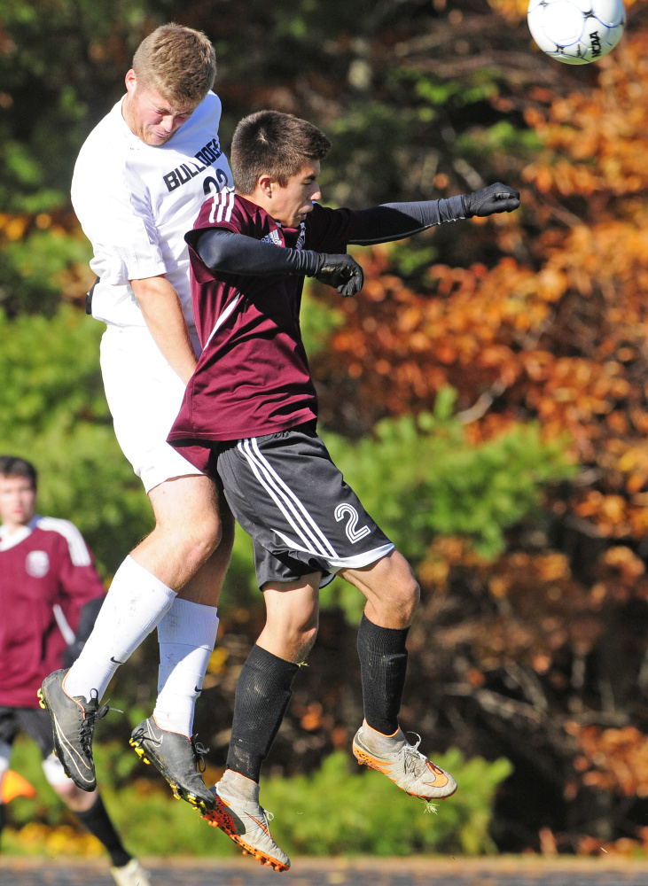 Hall-Dale’s Ryan Sinclair, left, and Monmouth’s Avery Pomerleau go up for a header during a Class C South semifinal game Wednesday.