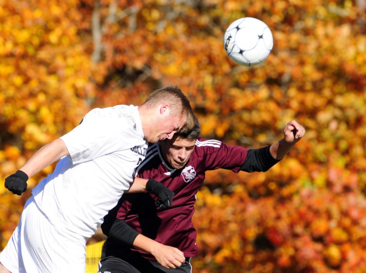 Hall-Dale senior Ryan Sinclair, left, and Monmouth’s Travis Hartford go for a header during a Class C South semifinal Friday in Farmingdale. The Mustangs won 2-1 in double overtime.