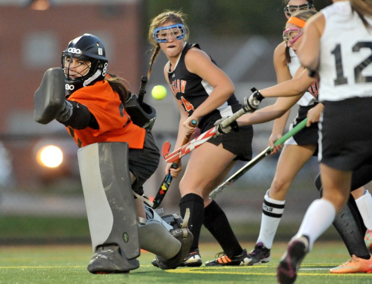 Winslow High School goalie Delaney Wood (22) makes a save against Skowhegan Area High School in the Kennebec Valley Athletic Conference field hockey championship earlier this month at Thomas College in Waterville. Wood and the Black Raiders will face York in the Class B state championship game at 2 p.m. today at the University of Maine.
