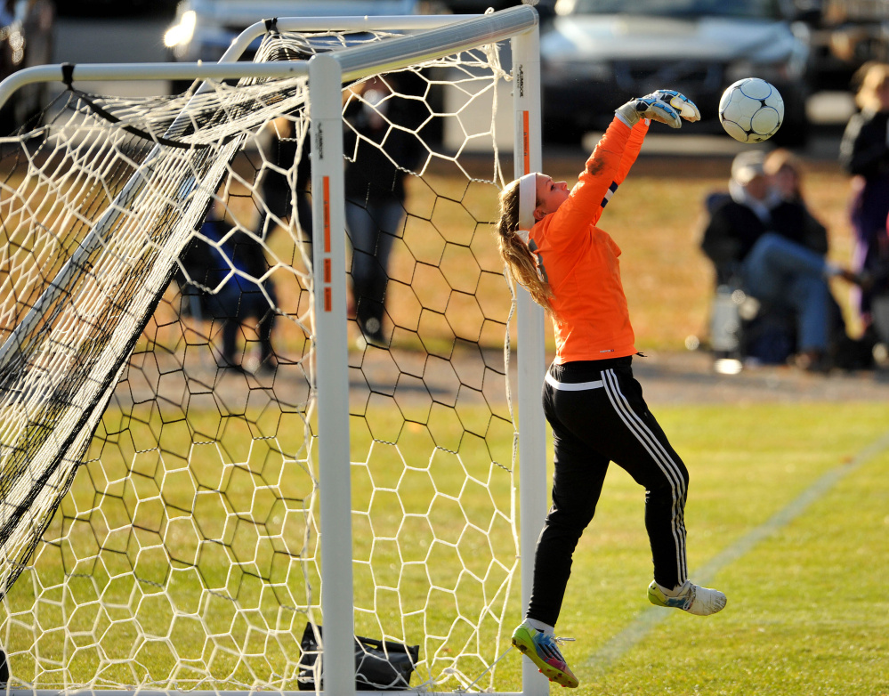 Madison goalie Erin Whalen makes a save against Waynflete during a Class C South semifinal game Friday in Madison.
