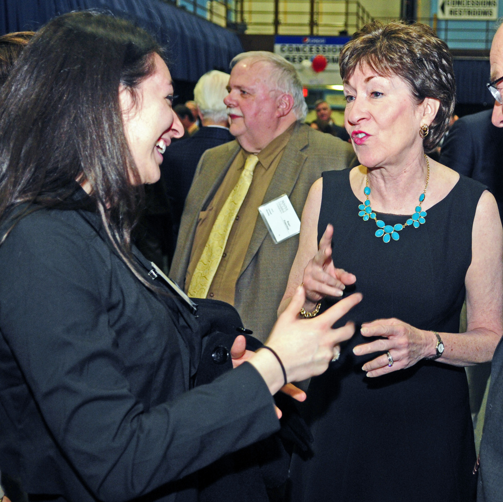 Kristin Bishop, left, chats with U.S. Sen. Susan Collins before the Maine State Chamber of Commerce dinner on Friday at the Augusta Civic Center. Bishop, a Bowdoin College sophomore from Madison, said that she had served as in intern in Collins’ Augusta office.