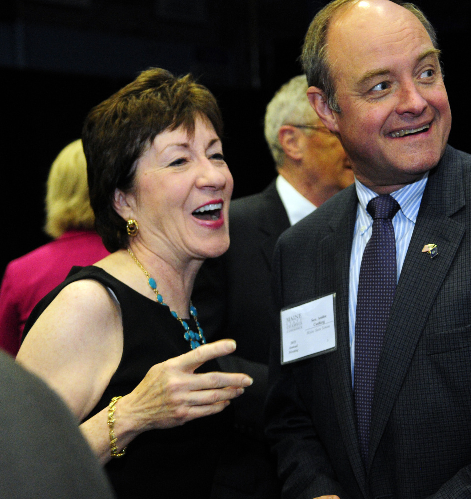 U.S. Sen. Susan Collins, left, chats with state Sen. Andre Cushing, R-Hampden, before the Maine State Chamber of Commerce dinner on Friday at the Augusta Civic Center.