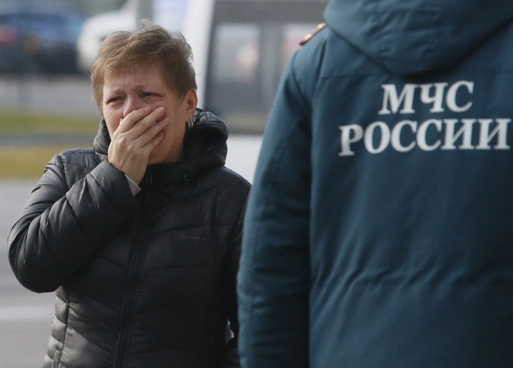 A relative of the victims of a Russian airliner with 217 passengers and seven crew aboard has crashed, reacts at Pulkovo airport in St.Petersburg, Russia, on Saturday.