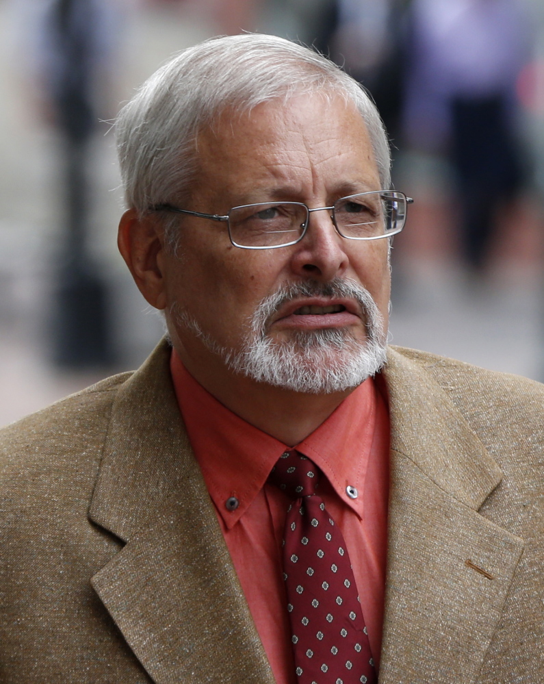 Michael Geilenfeld arrives at U.S. Bankruptcy Court, Thursday, July 9, 2015, in Portland, Maine. Geilenfeld, an orphanage founder, and Raleigh, North Carolina-based Hearts with Haiti have brought a civil lawsuit against activist Paul Kendrick who they say made reckless allegations and "vicious attacks" that hurt Geilenfeld's fundraising efforts and damaged his reputation. This month, the Haitian National Police arrested Geilenfeld on charges of indecent assault and conspiracy, dramatically cuffing him at the orphanage in Port-au-Prince and hauling him away in the bed of a pickup truck. (AP Photo/Robert F. Bukaty)
