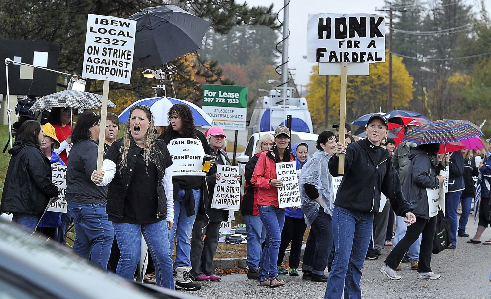 FairPoint workers picket in October 2014 at the company's offices on Davis Farm Road in Portland. A state commissioner has reversed a ruling that FairPoint workers who went on strike were eligible for unemployment benefits.
Gordon Chibroski/Staff Photographer